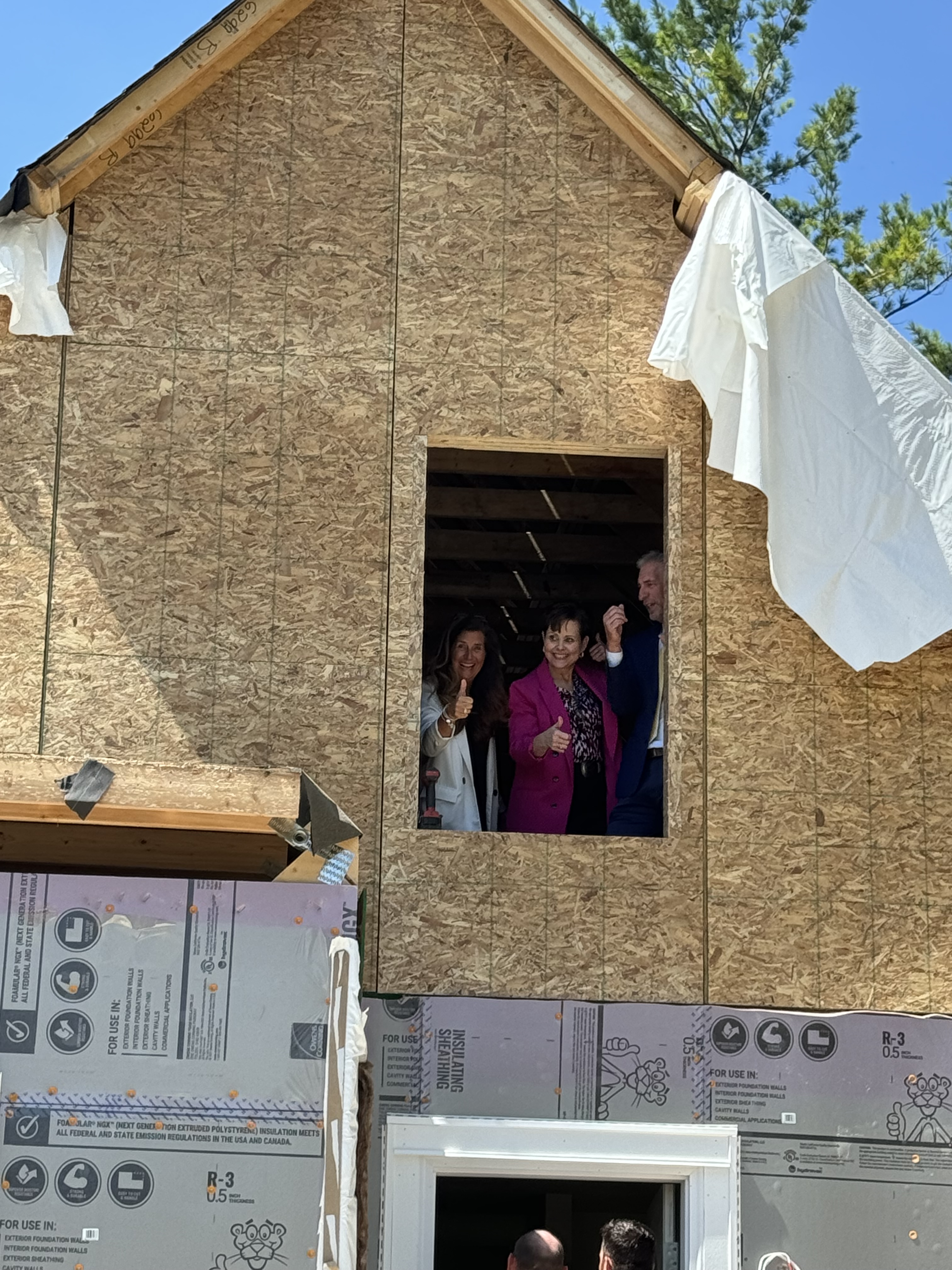 Beth Charlton and Carmen Mora in the window of a Habitat house